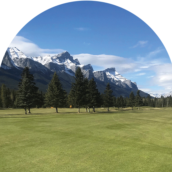 golf course turf with snowy mountain view