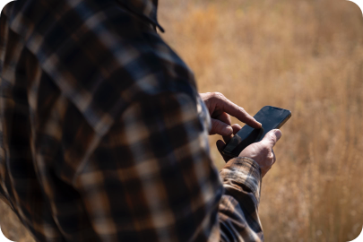 man tapping cell phone